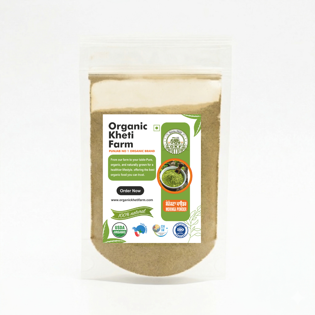 Close-up of organic Moringa Powder in a glass jar with green leaves in the background, highlighting freshness and quality
