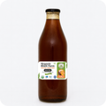 Bottle of organic cold pressed black mustard oil from Punjab farm, highlighting traditional extraction process and natural purity