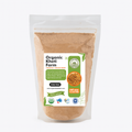 Organic desi jaggery powder in a traditional Indian bowl, showcasing natural, farm-fresh quality from Punjab