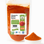 Close-up of vibrant red organic chilli powder in a traditional spice jar, sourced directly from Punjab farm, highlighting natural quality and freshness