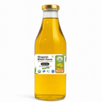 Close-up of organic yellow mustard seeds being cold-pressed into pure mustard oil from Punjab farm
