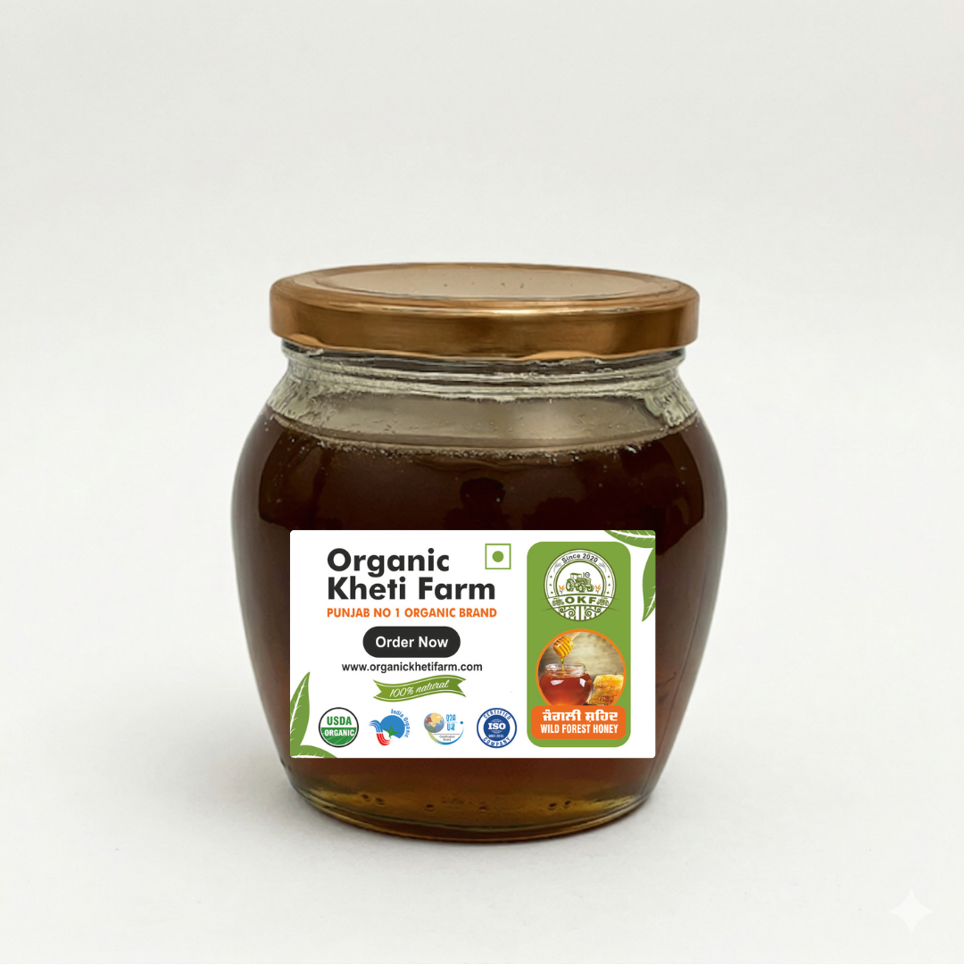 Glass jar of organic wild forest raw honey from Punjab with natural honey dripping from a spoon