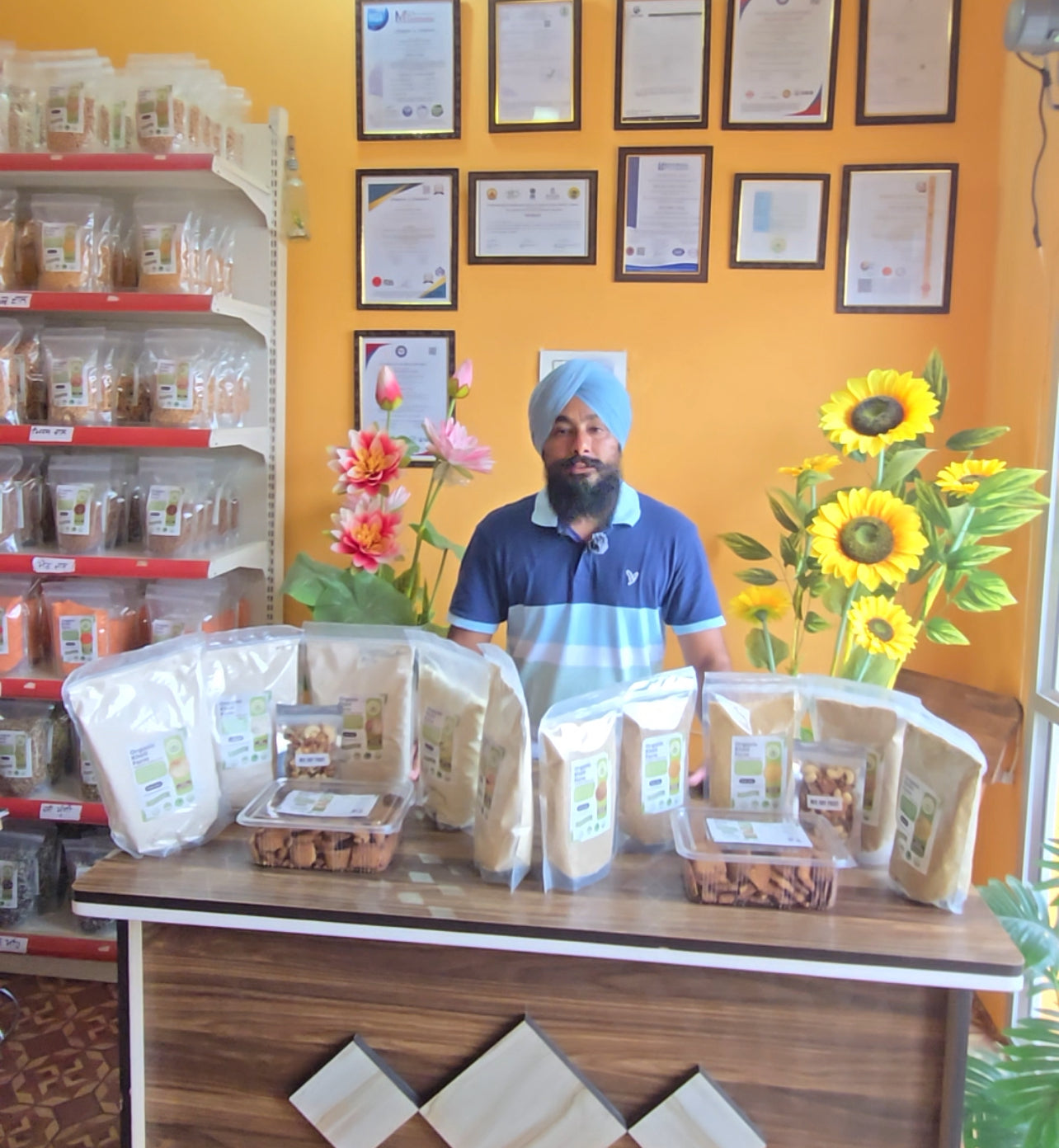Assorted millet, dry fruits, and millet biscuits in a festive gift box from Punjab farm, highlighting natural and organic quality.