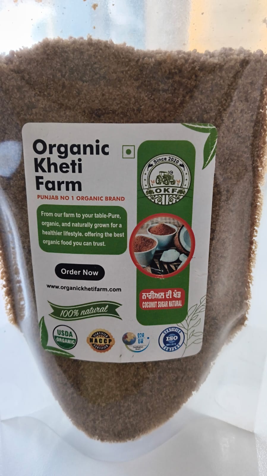 Close-up of organic coconut sugar granules from Punjab farm, highlighting natural caramel color and texture for healthy sweetening.