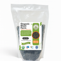 Close-up of organic black urad sabut dal grains from Punjab farm, showcasing natural, unpolished pulses for healthy cooking.