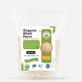 Close-up of organic Urad Mogar Dal split black gram from Punjab farm, showcasing fresh, unpolished pulses in a bowl